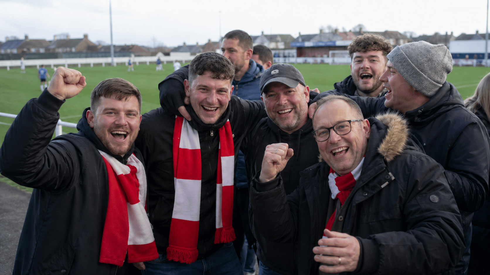 Wayton Rovers FC fans huddled outside the clubhouse